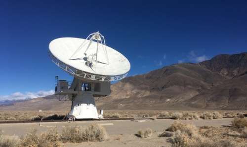 Large satellite dish in the desert